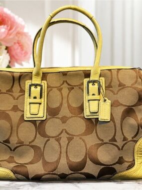 This item is a vintage Coach Hamptons Signature Carryall Handbag